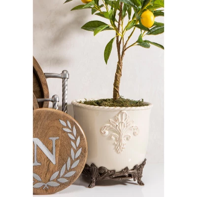 GG Collection Cream Stoneware Planter On Metal Acanthus Leaf Base. 1 GG Collection Cream Stoneware Planter On Metal Acanthus Leaf Base.